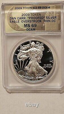 2009 Token DAN CARR PROOFED SILVER EAGLE OVERSTRUCK THIN DC MS69 DCAM